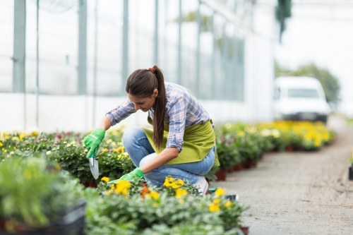 Protective equipment and safety signage at a garden worksite